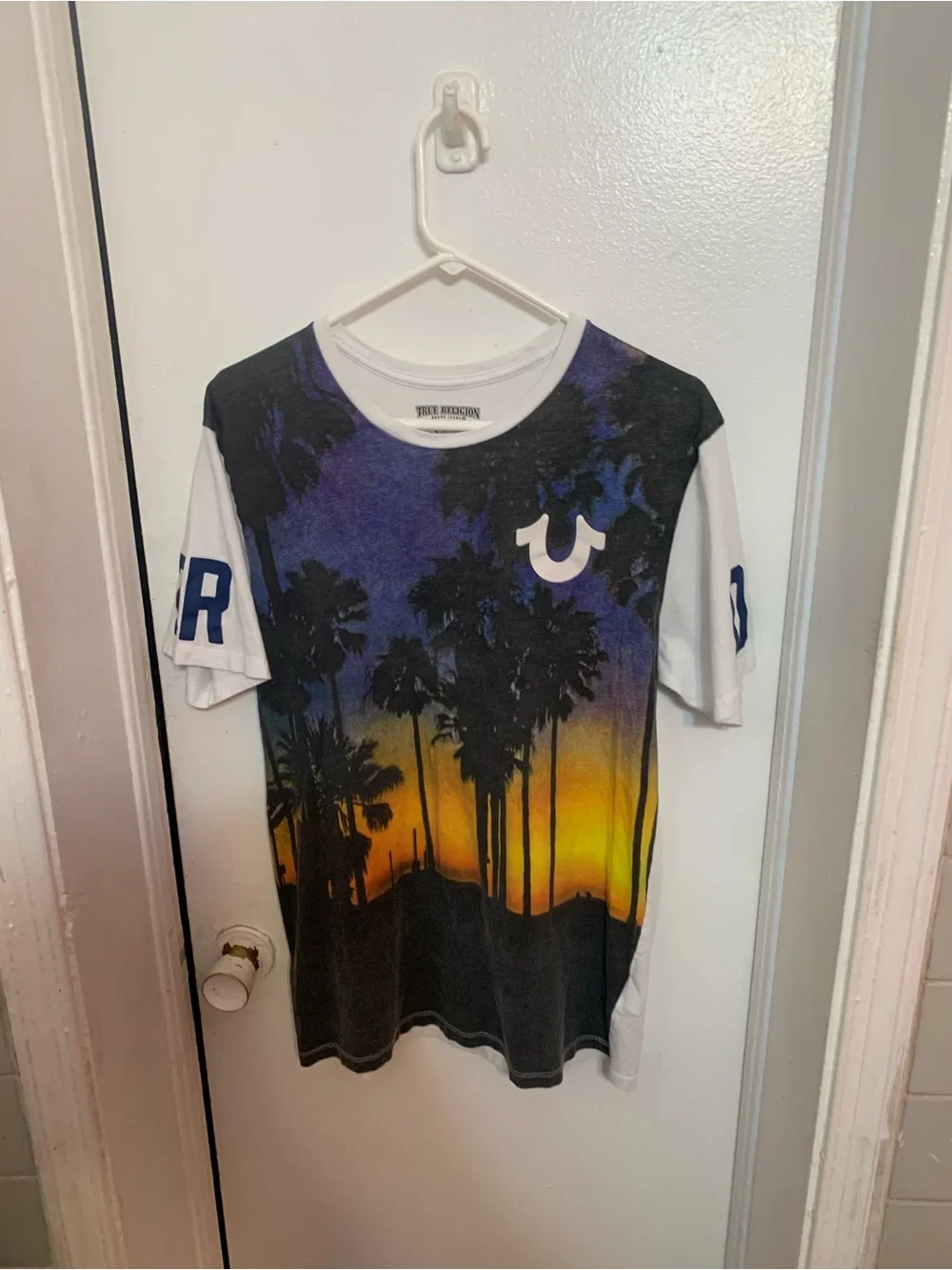 True Religion Men’s White-Rim Graphic Tee with Black and Purple Print